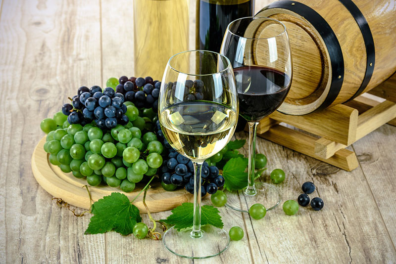Red and White wine with grapes.